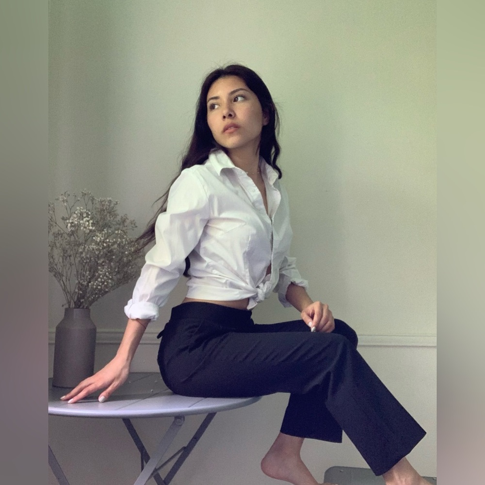 Plain black dress pants with adjustable strap and pockets